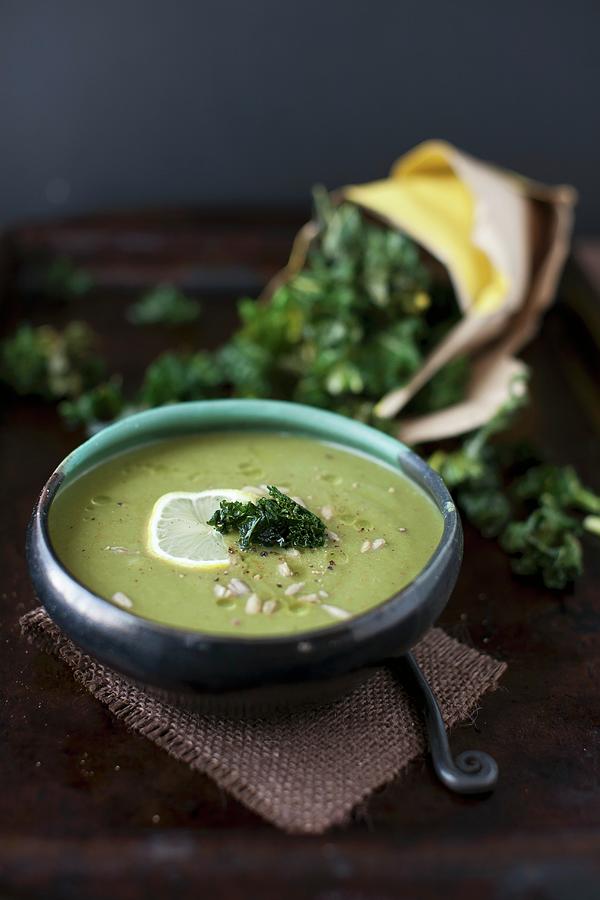 A Bowl Of Celeriac And Spinach Soup With Kale Chips Photograph by Strokin, Yelena