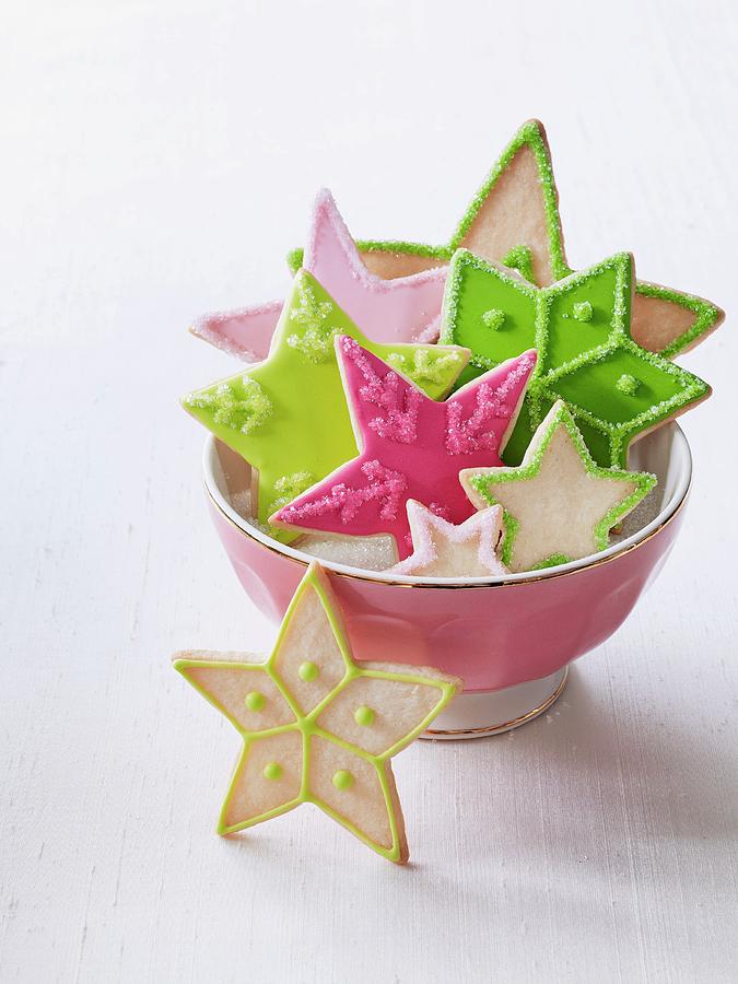 A Bowl Of Colourful Christmas Star Biscuits Photograph by Antonis Achilleos