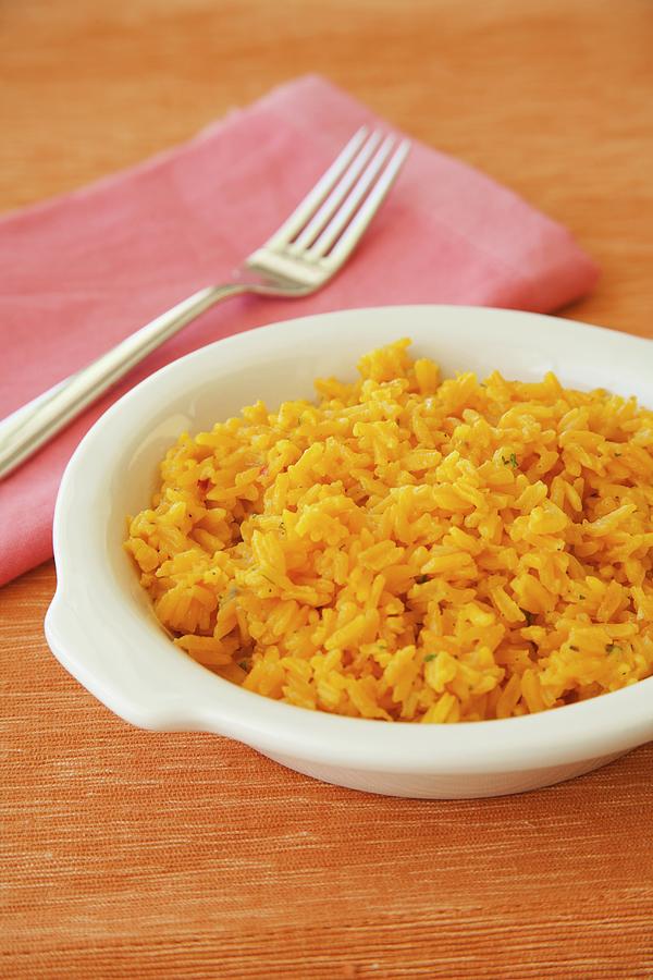 A Bowl Of Cuban Style Yellow Rice Photograph by Poplis, Paul - Fine Art