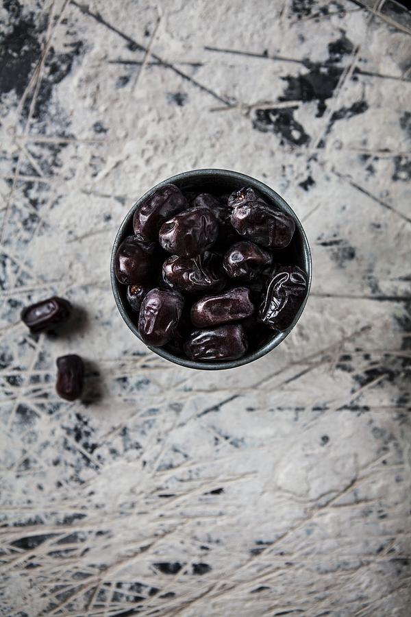 A Bowl Of Dates seen From Above Photograph by Nika Moskalenko