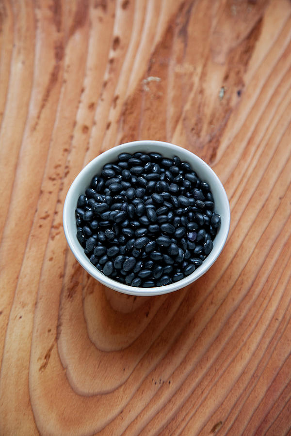 A Bowl Of Dried Black Beans Photograph by Julia Skowronek