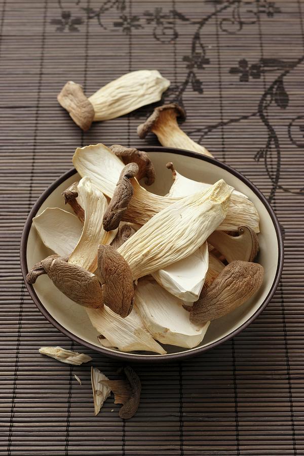 A Bowl Of Dried King Trumpet Mushrooms Photograph by Petr Gross