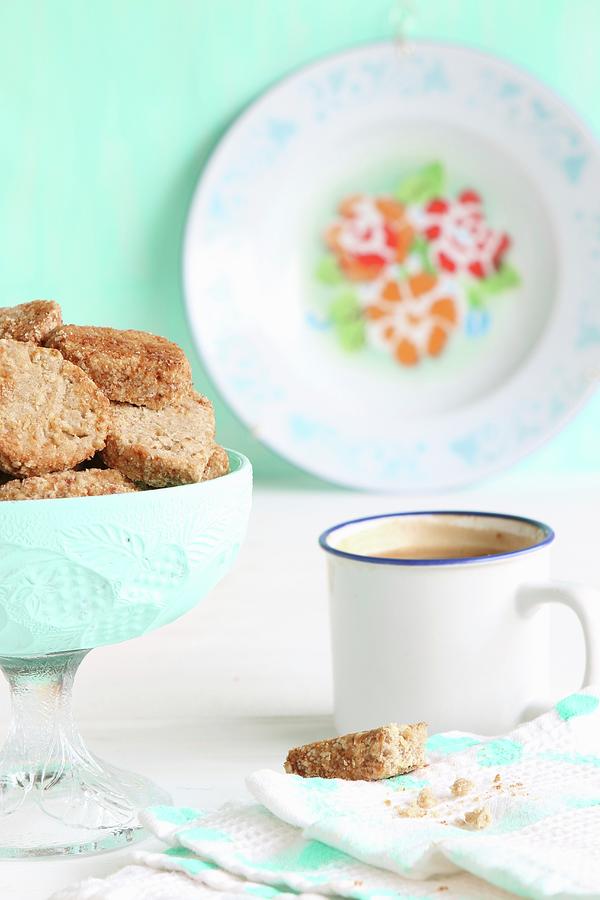 A Bowl Of Gluten-free Biscuits With Buckwheat Flour And Coconut Blossom Sugar, And Coffee In An Enamel Cup Photograph by Regina Hippel