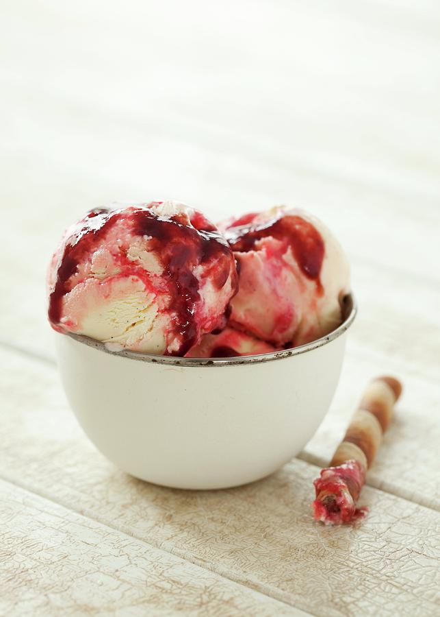 A Bowl Of Icecream With Raspberry Sauce And A Wafer Cigar Photograph by Jane Saunders