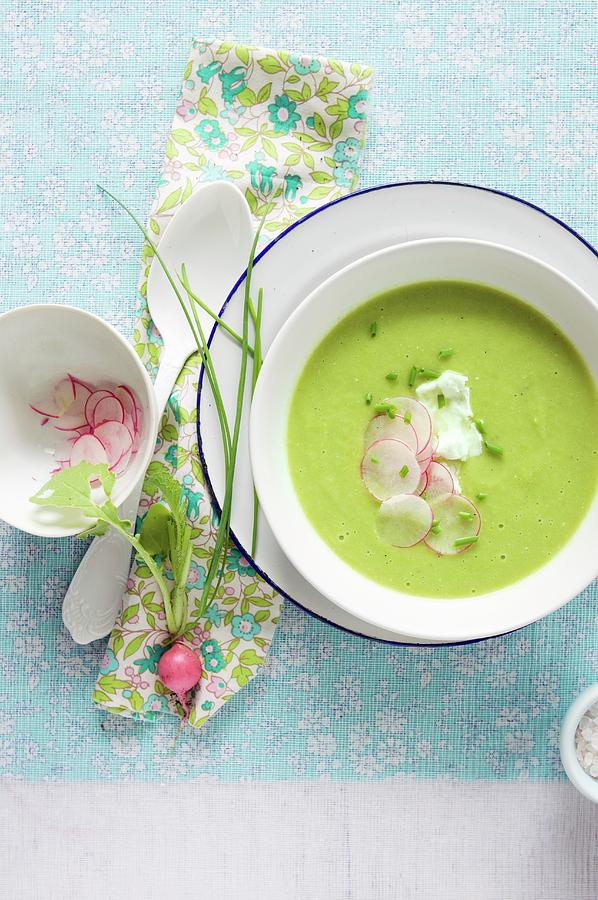 A Bowl Of Pea Soup With Thinly Sliced Radish Garnish Photograph by Peltre, Beatrice