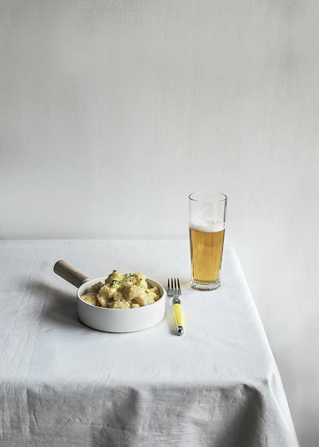 A Bowl Of Potato Salad And A Glass Of Beer On A Table Photograph by Miriam Garcia