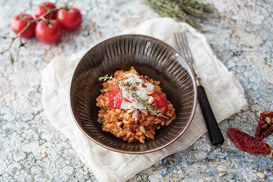 A Bowl Of Risotto With Sun-dried Tomatoes Photograph by Jan Wischnewski