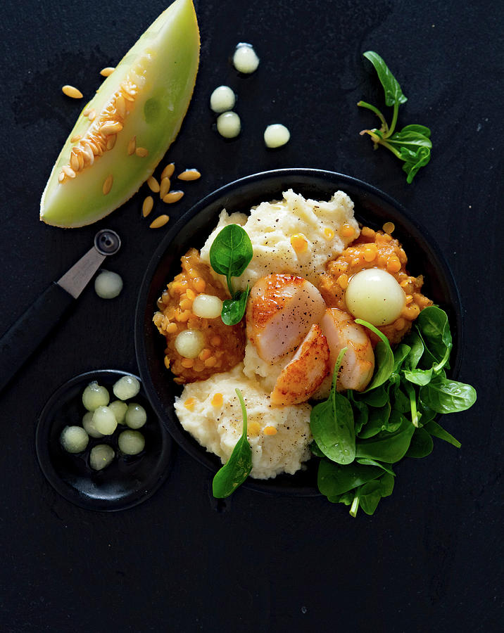 A Bowl Of Scallops, Celery Pure, Lentil Dhal, Spinach Salad And Honeydew Melon Photograph by Udo Einenkel
