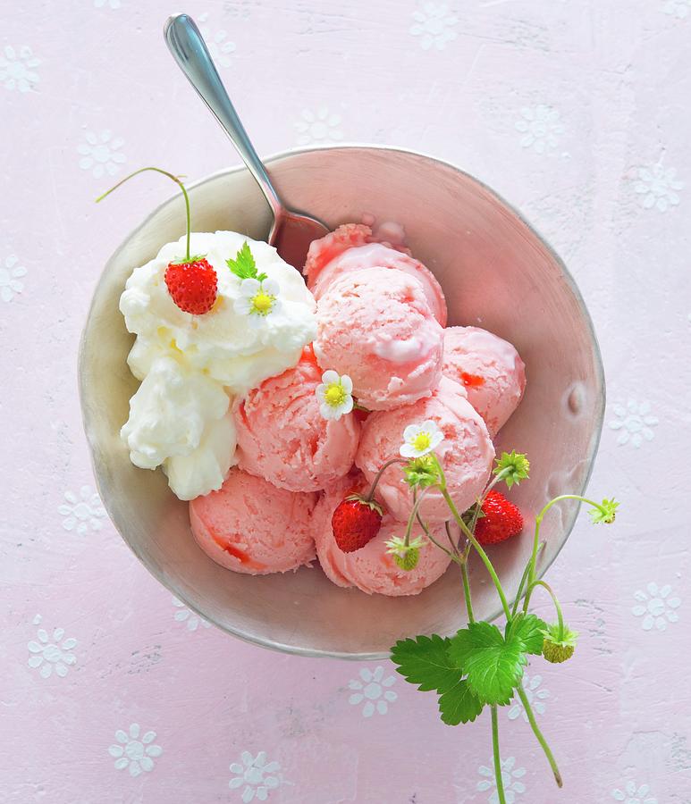 A Bowl Of Strawberry Ice Cream, Whipped Cream And Wild Strawberries Photograph by Udo Einenkel