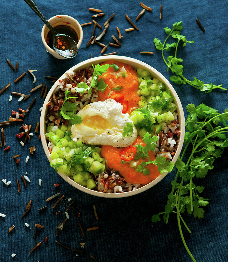 A Bowl With Rice, Cucumber, Tomato Sauce And A Poached Egg Photograph by Udo Einenkel
