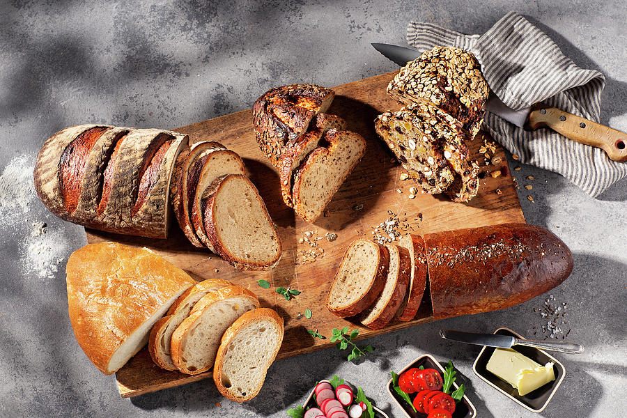 A Bread Buffet On A Chopping Board Photograph by Christian Schuster