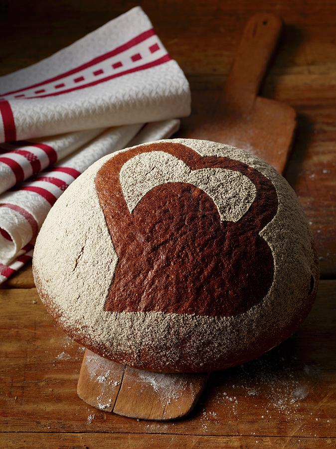 A Bread Roll Decorated With A Heart Design Photograph by Rees, Peter ...