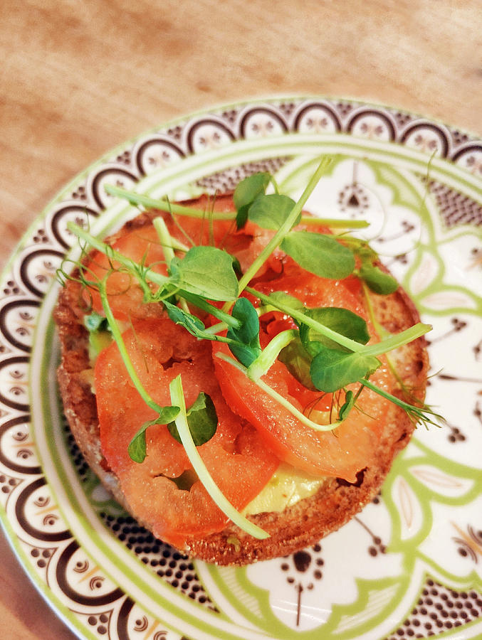 A Bread Roll Topped With Tomatoes And Pea Sprouts Photograph by Petr Gross