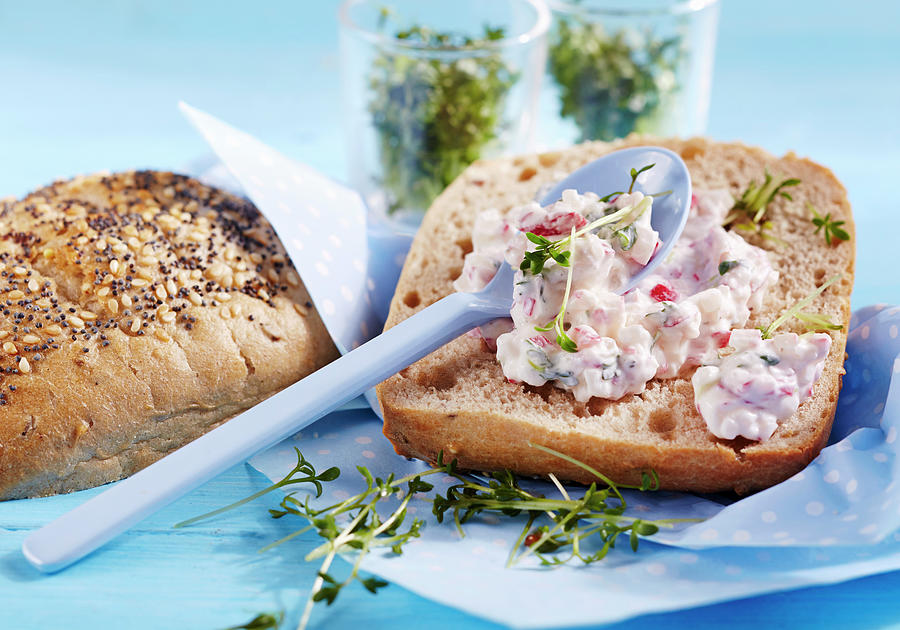 A Bread Roll With Radish And Cress Spread Photograph by Teubner Foodfoto