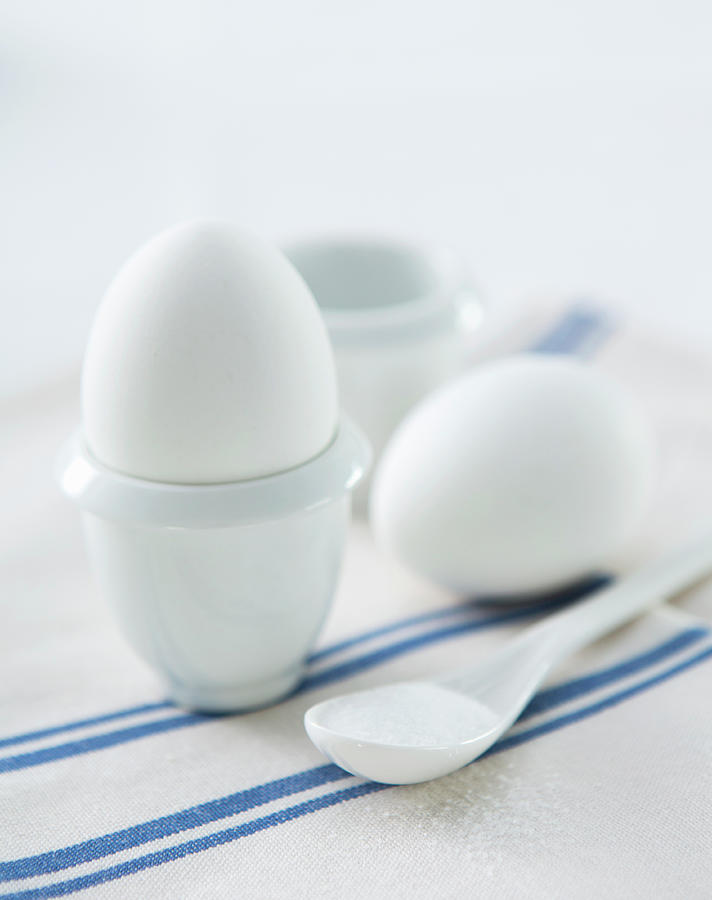 A Breakfast Egg In An Eggcup On A Blue And White Striped Cloth Napkin Photograph by Jennifer Braun