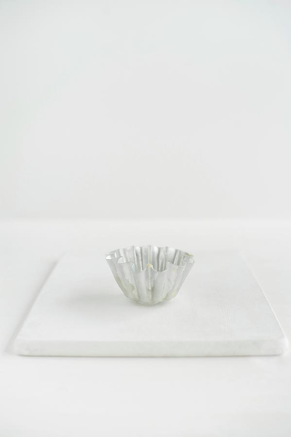 A Brioche Tin On A White Board Photograph by Magdalena Hendey