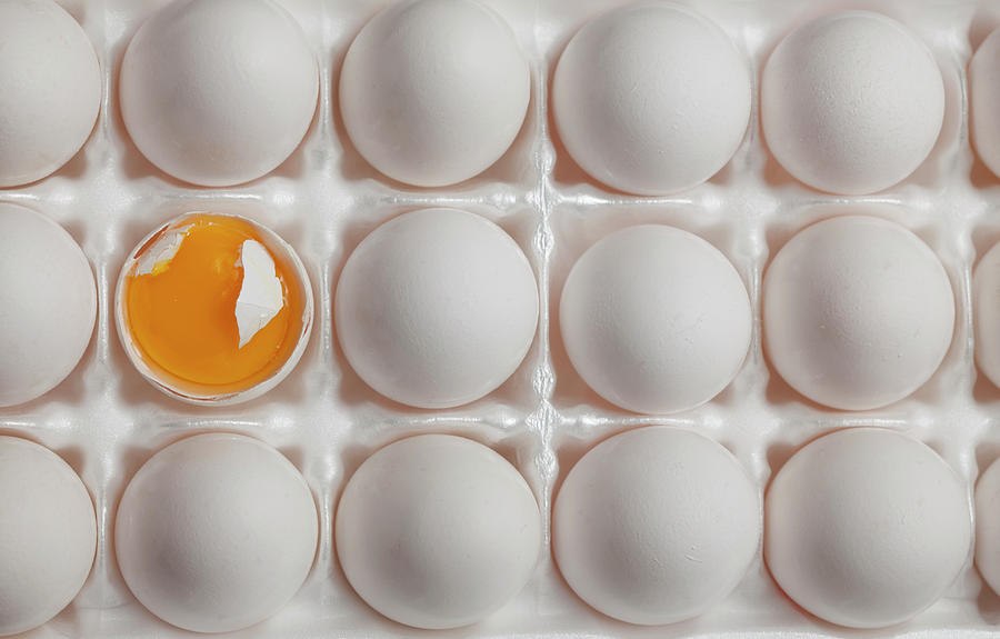 A Broken Egg And Its Egg Yolk Amongst Photograph by Jonathan Gelber