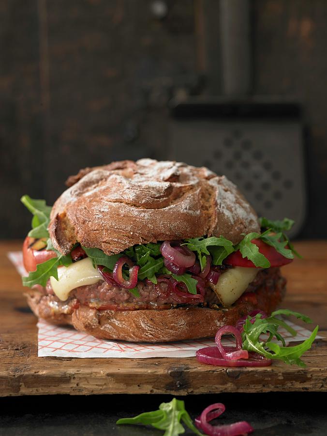 A Brown Bread Burger With Mountain Cheese, Minced Lamb, Grilled Apple And Sweet And Sour Onions Photograph by Jan-peter Westermann
