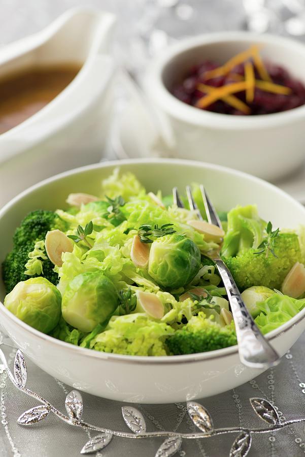 A Brussels Sprouts And Broccoli Medley With Flaked Almonds Photograph by Jonathan Short