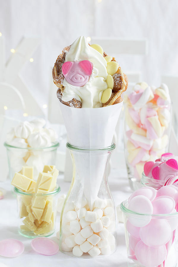 Ice Cream Photograph - A Bubble Waffle With Frozen Yoghurt, A Gummy Pig Sweet And White Chocolate by Esther Hildebrandt