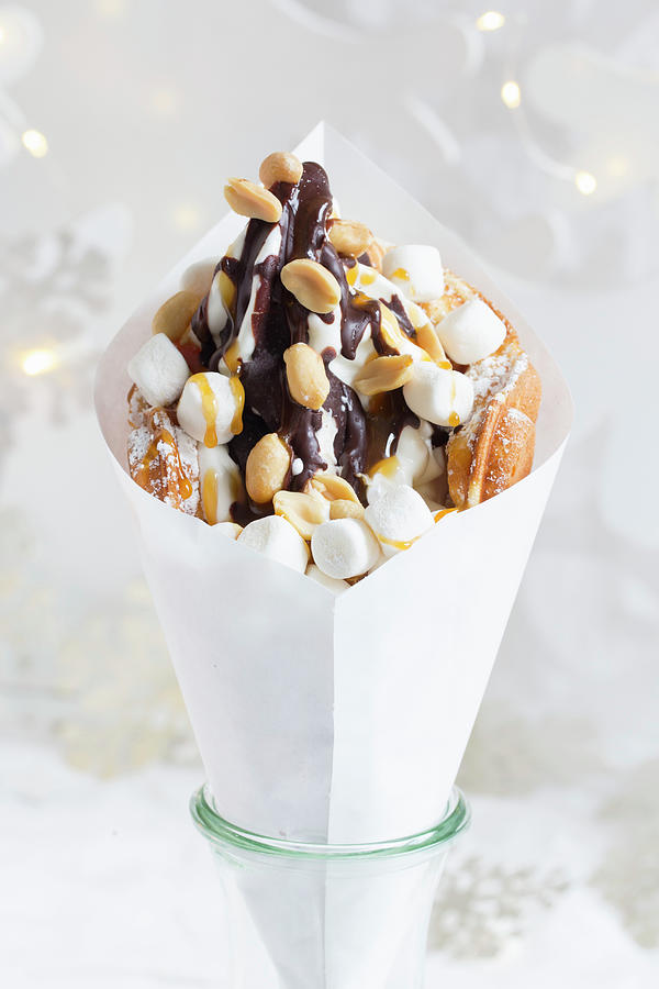 A Bubble Waffle With Frozen Yoghurt, Chocolate Sauce, Peanuts, Caramel Sauce And Marshmallows christmas Photograph by Esther Hildebrandt