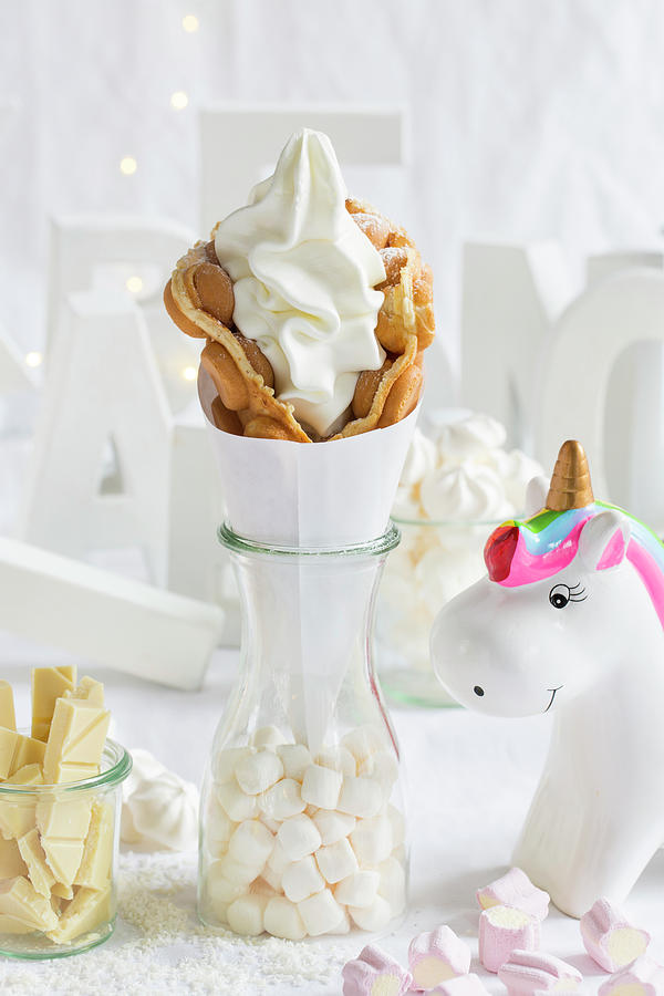 A Bubble Waffle With Frozen Yoghurt Next To A Unicorn Decoration Photograph by Esther Hildebrandt