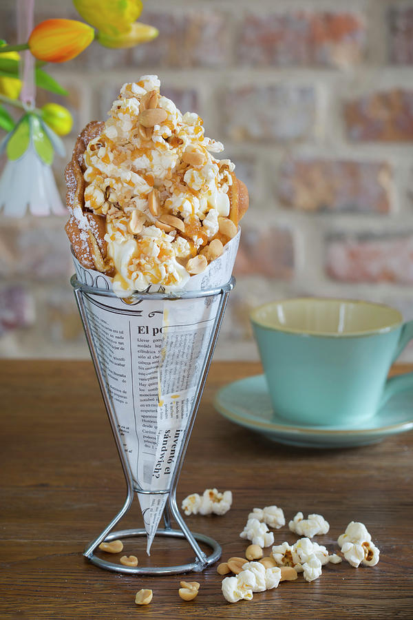 A Bubble Waffle With Popcorn, Caramel Sauce, Peanuts And Sea Salt Photograph by Esther Hildebrandt