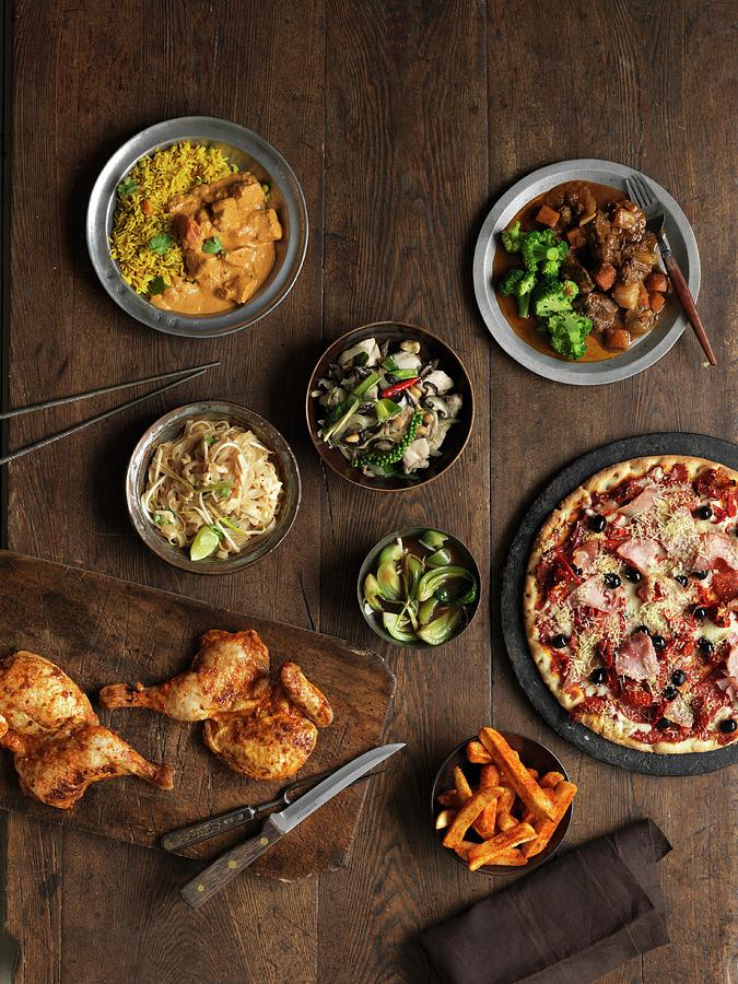 A Buffet Featuring Roast Chicken Legs, Pizza, Irish Stew, Chicken Curry, Vegetables, Salad, Pad Thai And Chips Photograph by Jonathan Gregson