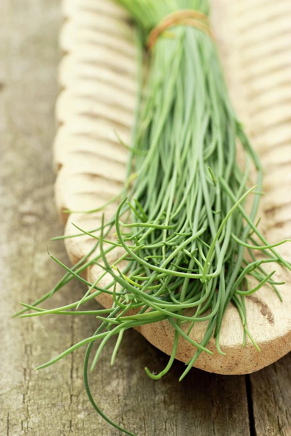 A Bunch Of Chives In A Wooden Serving Dish Photograph by Gross, Petr