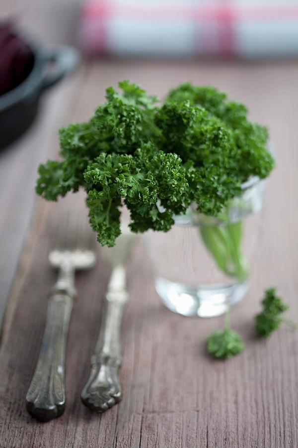 A Bunch Of Parsley In A Glass Photograph by Martina Schindler