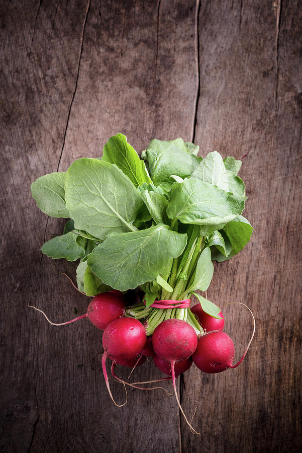 A Bunch Of Radishes On A Wooden Background Photograph by Nitin Kapoor