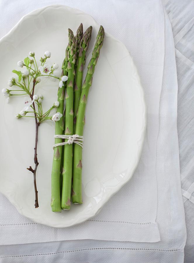 A Bundle Of Asparagus And Apple Blossom On A Serving Platter seen From Above Photograph by Katharine Pollak