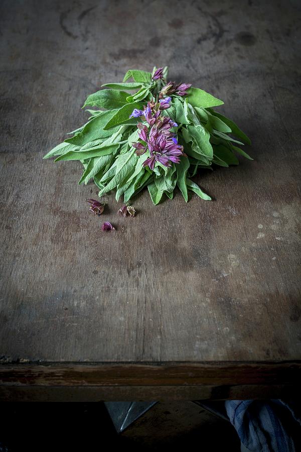 A Bundle Of Flowering Sage On A Wooden Table Photograph by Food With A View