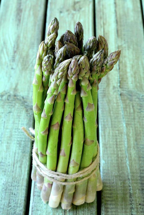 A Bundle Of Fresh Green Asparagus Photograph by Dorota Piekarska
