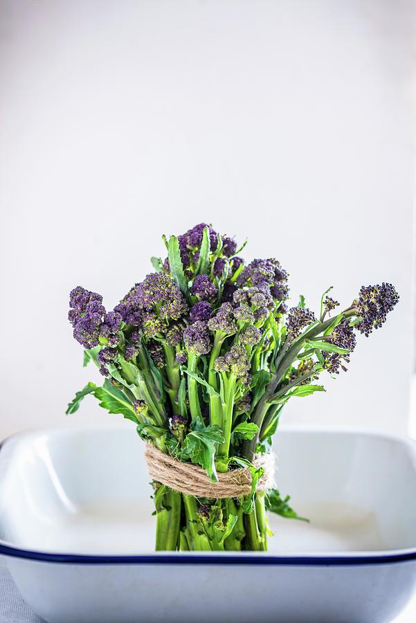 A Bundle Of Purple Sprouting Broccoli In An Enamel Bowl Photograph by Nitin Kapoor