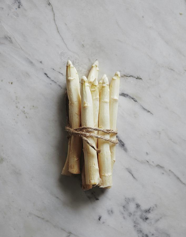 A Bundle Of White Asparagus Tied With Kitchen Twine Photograph by Fanny Rdvik