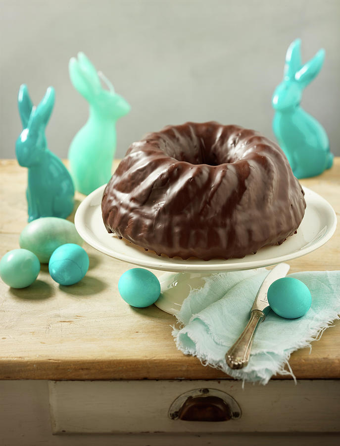 A Bundt Cake With Chocolate Glaze And Easter Decorations Photograph by Michael Lffler
