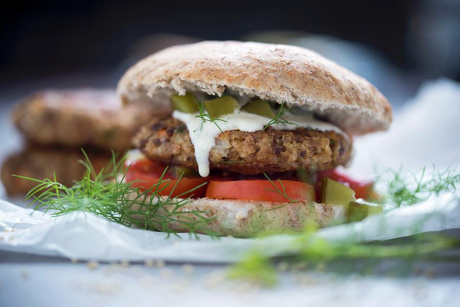 A Burger With A Millet Fritter, Tomato, And A Dill And Cucumber Sauce vegan Photograph by Kati Neudert