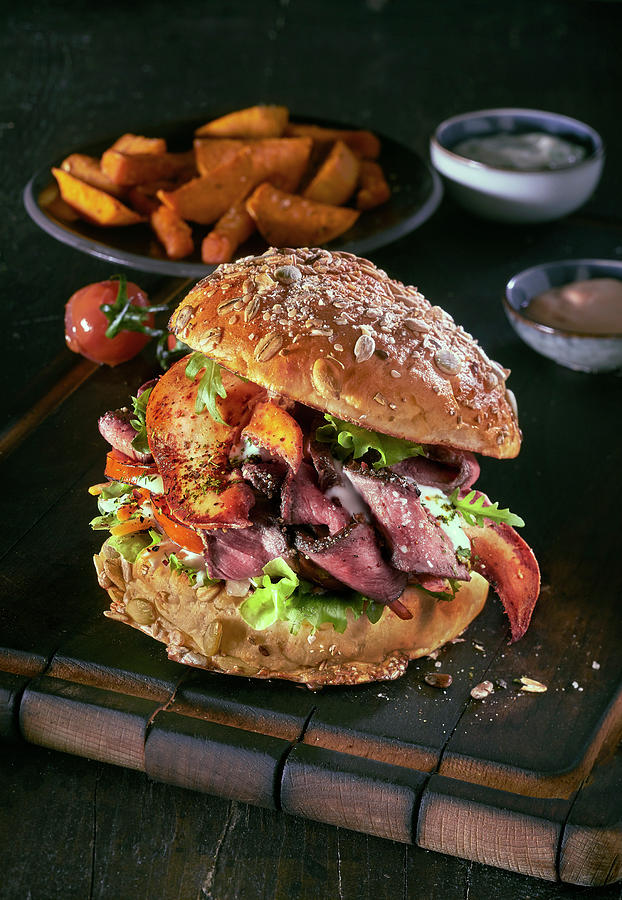 A Burger With Roast Beef, Lobster And Potato Wedges Photograph by Daniel Reiter