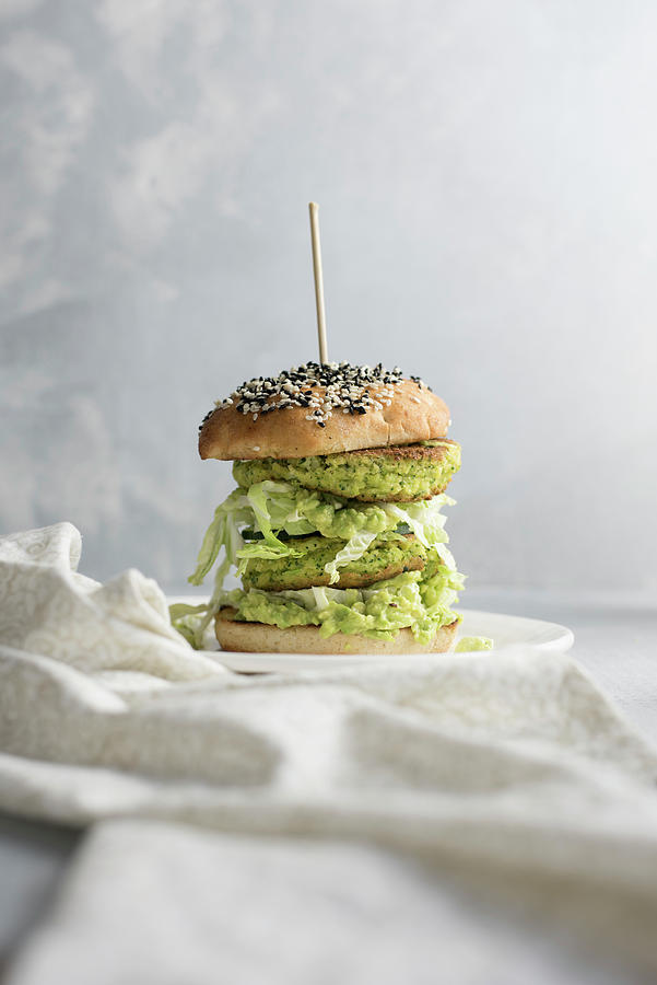 A Burger With Zucchini Patties, Cabbage And Avocado Cream Photograph by Healthylauracom