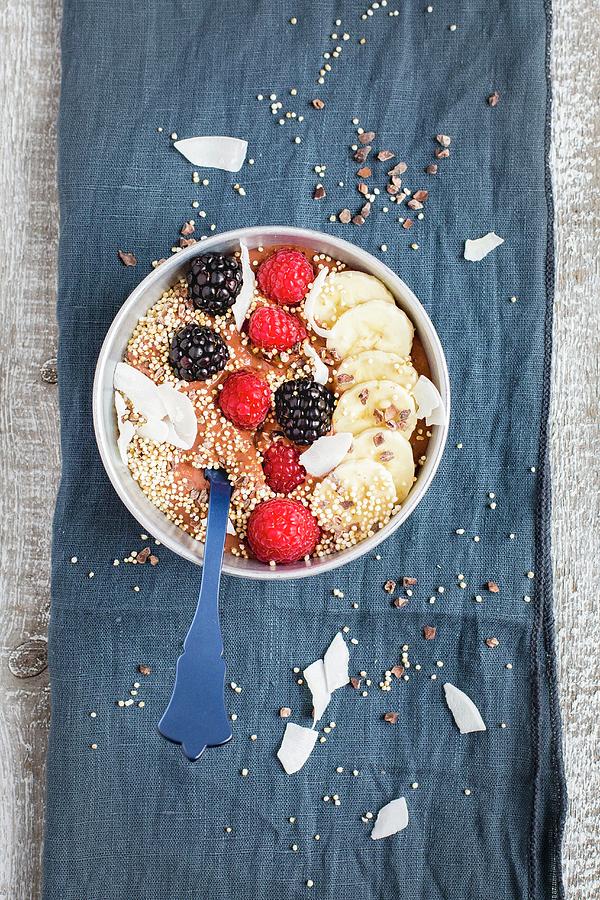 A Cacao Smoothie Bowl With Berries, Banana, Coconut Chips And Popped Amaranth Photograph by Tina Engel