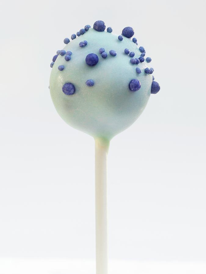 A Cake Pop With Blue Glaze And Sugar Pearls Photograph by Garlick, Ian