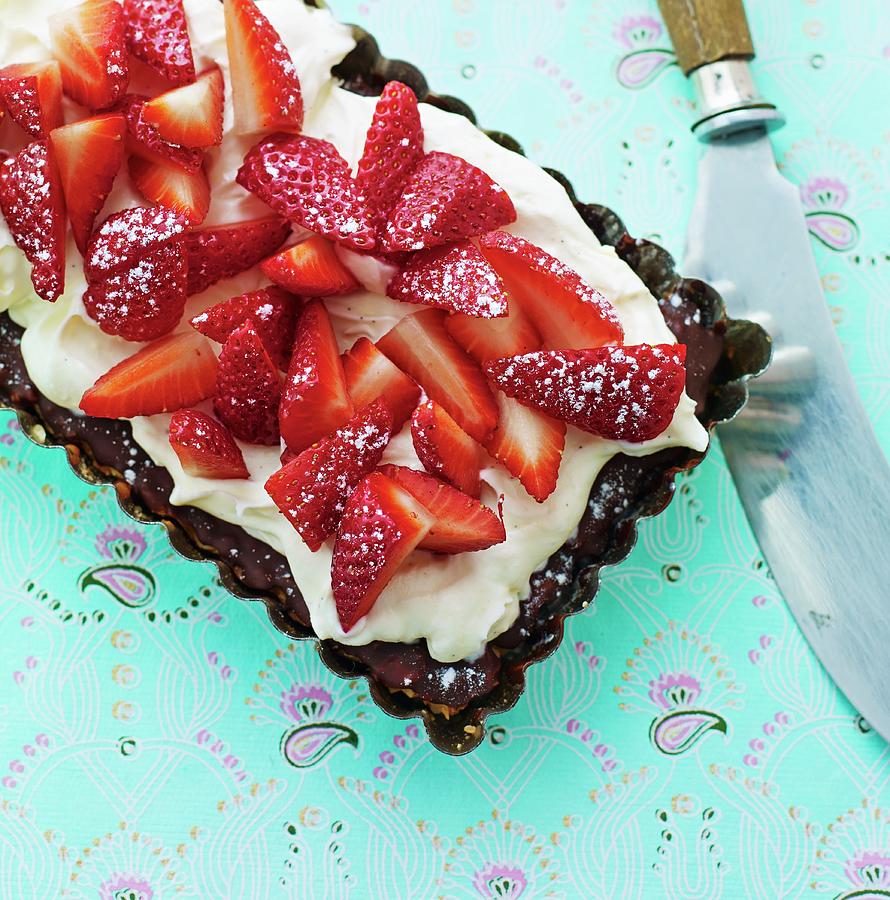 A Cake With Chocolate Glaze, Vanilla Cream And Strawberries Photograph by Lars Ranek