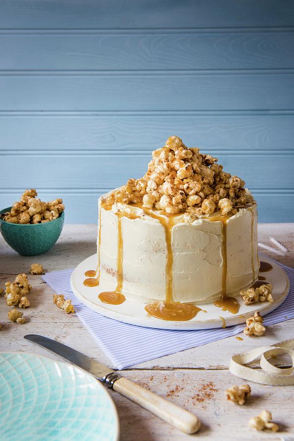 A Cake With White Chocolate Buttercream Icing And Cinnamon Toffee Popcorn Photograph by Magdalena Hendey