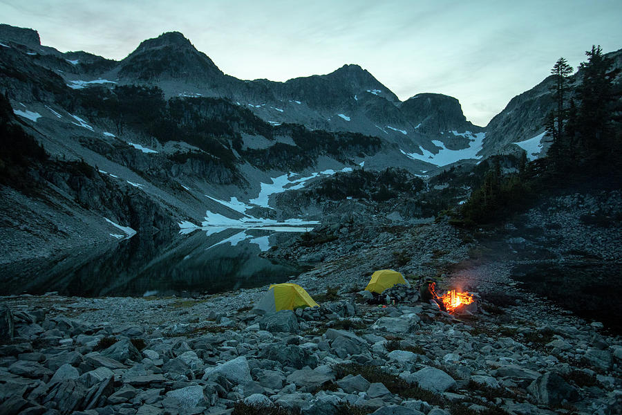 Mountain Photograph - A Campsite Glows On A Summer Night In The Mountains. by Cavan Images