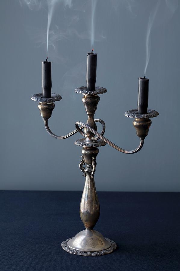A Candelabra With Three Dark Candles Just Blown Out Photograph by Jennifer Martine