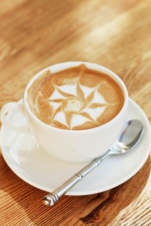 A Cappuccino With A Star Pattern In The Milk Foam Photograph by Chuck Place