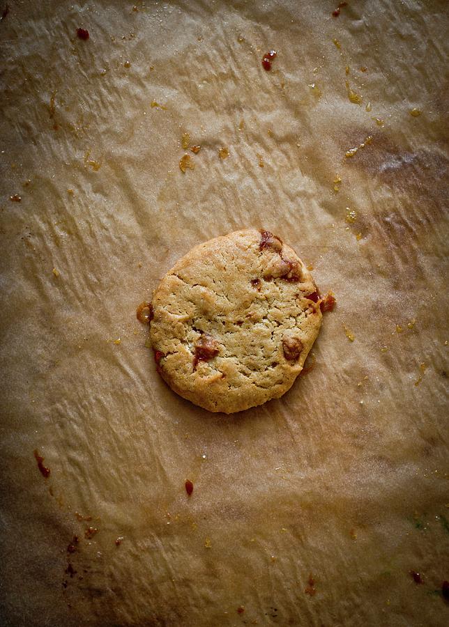 A Caramel Cookie On Baking Paper Photograph by Dorota Indycka