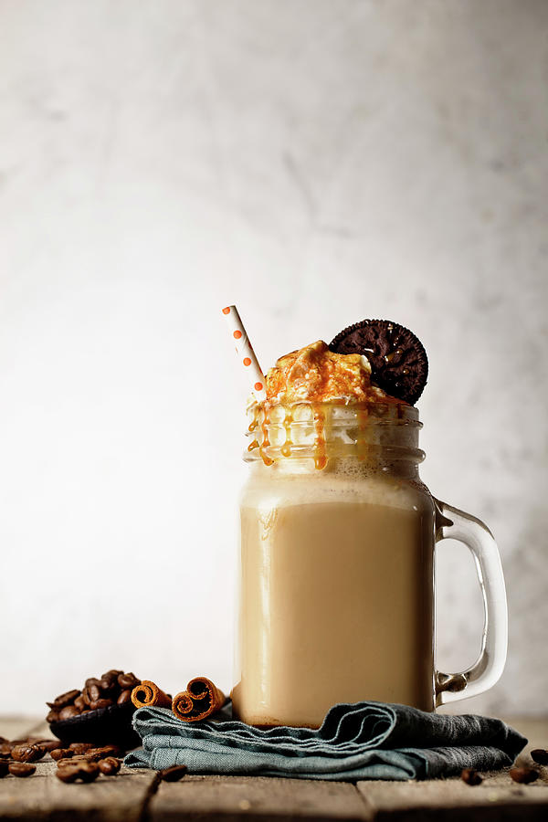 Coffee Photograph - A Caramel Latte With Cream And A Cookie by Valeria Aksakova