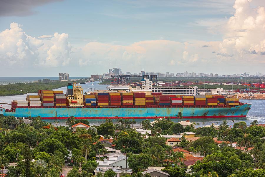 Transportation Photograph - A Cargo Ship Passes Through The Rivers by Sean Pavone